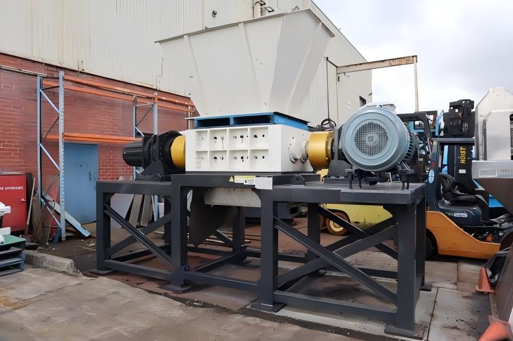 Heavy-duty industrial shredder processing scrap metal