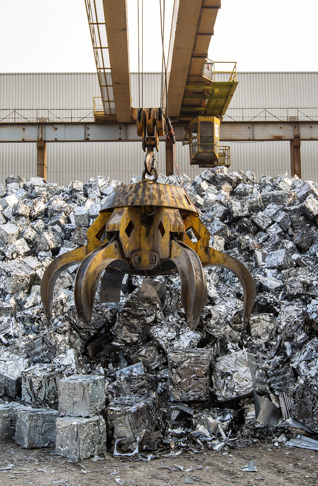Iron recycling process using a heavy-duty scrap metal baler